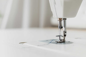 Sewing machine making high quality suspenders.